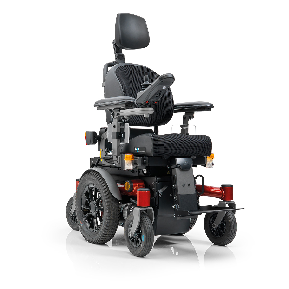Sango slimline MWD powered wheelchair with Sego junior seat system, front-wheel drive with headrest and red frame. Overall view, diagonal from the front. 